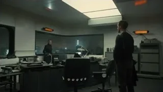 Man in office with city skyline view — Blade Runner 2049