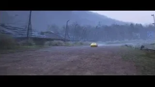 yellow car driving on foggy dirt track — Cars 3