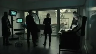 People in hospital room looking at patient screen — Blade Runner 2049
