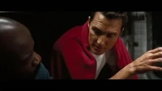 man in red cape focused intently — Interstellar