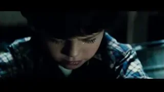 young boy in plaid shirt with serious expression — Superman: Man of Steel