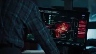 man in plaid shirt looking at computer monitor — The Avengers