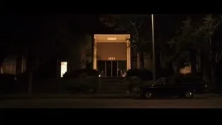 Building entrance lit up at night — Jobs