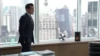 man in suit looking at city skyline — Suits