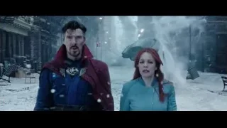 man in cape and woman on snowy street — Doctor Strange 2