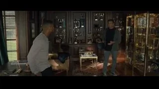 Two men by trophy display case — Creed 2