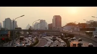 Busy highway at sunset with city traffic — The Karate Kid