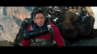 man with camera on rocky mountain — The Secret Life of Walter Mitty