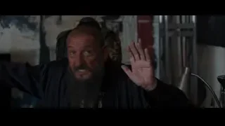 elderly man in black robe making stop gesture — Iron Man 3