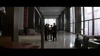 men in modern building with city view — Batman: The Dark Knight