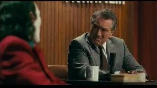 Joker sitting at table with wine — Joker