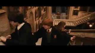 Three children on grand staircase in castle — Harry Potter and the Philosophers Stone