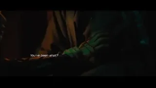 Person holding guitar in dark room — John Wick: Chapter 4