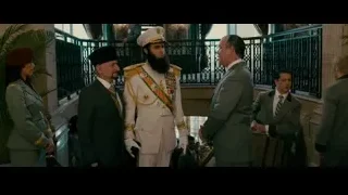 Man in white military uniform in lobby — The Dictator