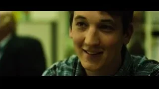 young man smiling in plaid shirt — Whiplash