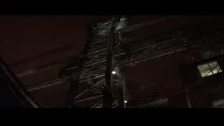 tall metal power line at night — Batman