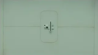 close-up of white door with handle — Blade Runner 2049