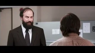 man and woman conversing in office — Jobs