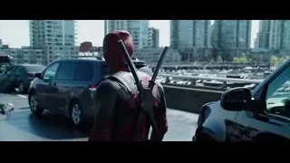 Deadpool in parking lot holding gun — Deadpool