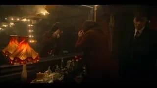 man in suit in dimly lit dressing room — Peaky Blinders