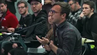 man speaking into microphone in lecture hall — Elon Musk: Return to Space