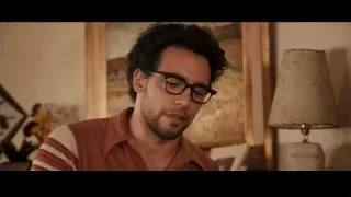 man with curly hair and glasses portrait — Jobs