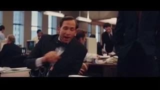 men in office with man in suit talking — The Wolf Of Wall Street