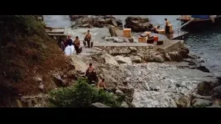 naked men carrying boxes on rocky path — Bruce Lee: Enter The Dragon