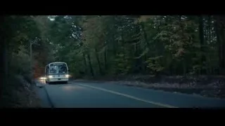 Man sitting on bus looking out window — John Wick