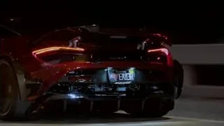 red sports car driving on highway at night — Sports Cars