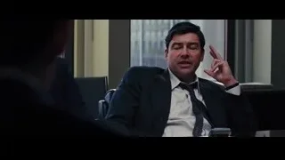 man in suit making a point in office — The Wolf Of Wall Street