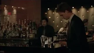 Two men at bar counter — Suits