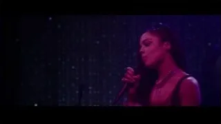 Young woman singing on stage — Creed