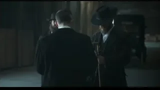Three men in suits in dimly lit room — Peaky Blinders