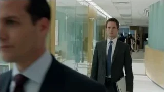 two men in suits walking hallway — Suits
