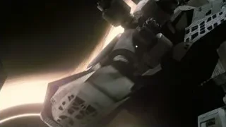 spaceship flying over ringed planet — Interstellar