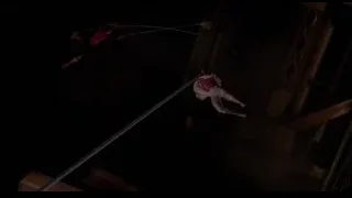 Two people performing aerial acrobatics on tightrope — Spider Man
