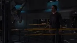 man in industrial room with yellow railing — The Avengers