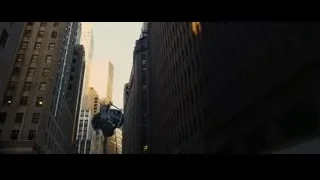cityscape with tall skyscraper and object — Batman: The Dark Knight Rises