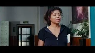 Woman in black hoodie smiling in hallway — The Karate Kid