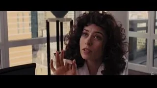 Young woman at table with city view — The Wolf Of Wall Street