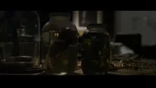 man sitting at a desk in a dark room — The Amazing Spider Man