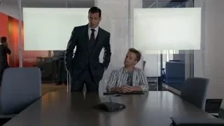 man in suit giving presentation in office — Suits