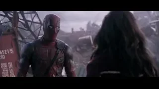 Deadpool in rubble with woman looking — Deadpool