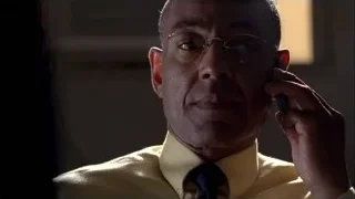 man talking on phone in dimly lit room — Breaking Bad