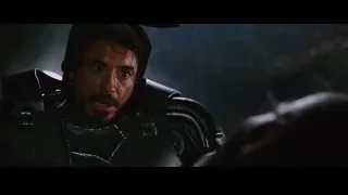 man in black armor with helmet — Iron Man