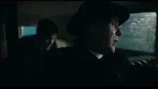 man in hat looking out car window — Peaky Blinders