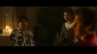 Man and woman conversing in dimly lit living room — Spiderman: No Way Home