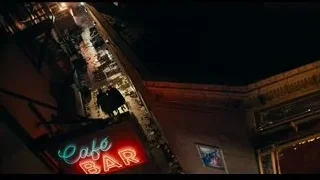 Street at night with Cafe Bar neon sign — Joker