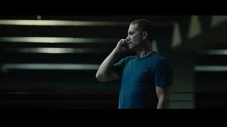 man in dimly lit room with staircase — Furious Seven